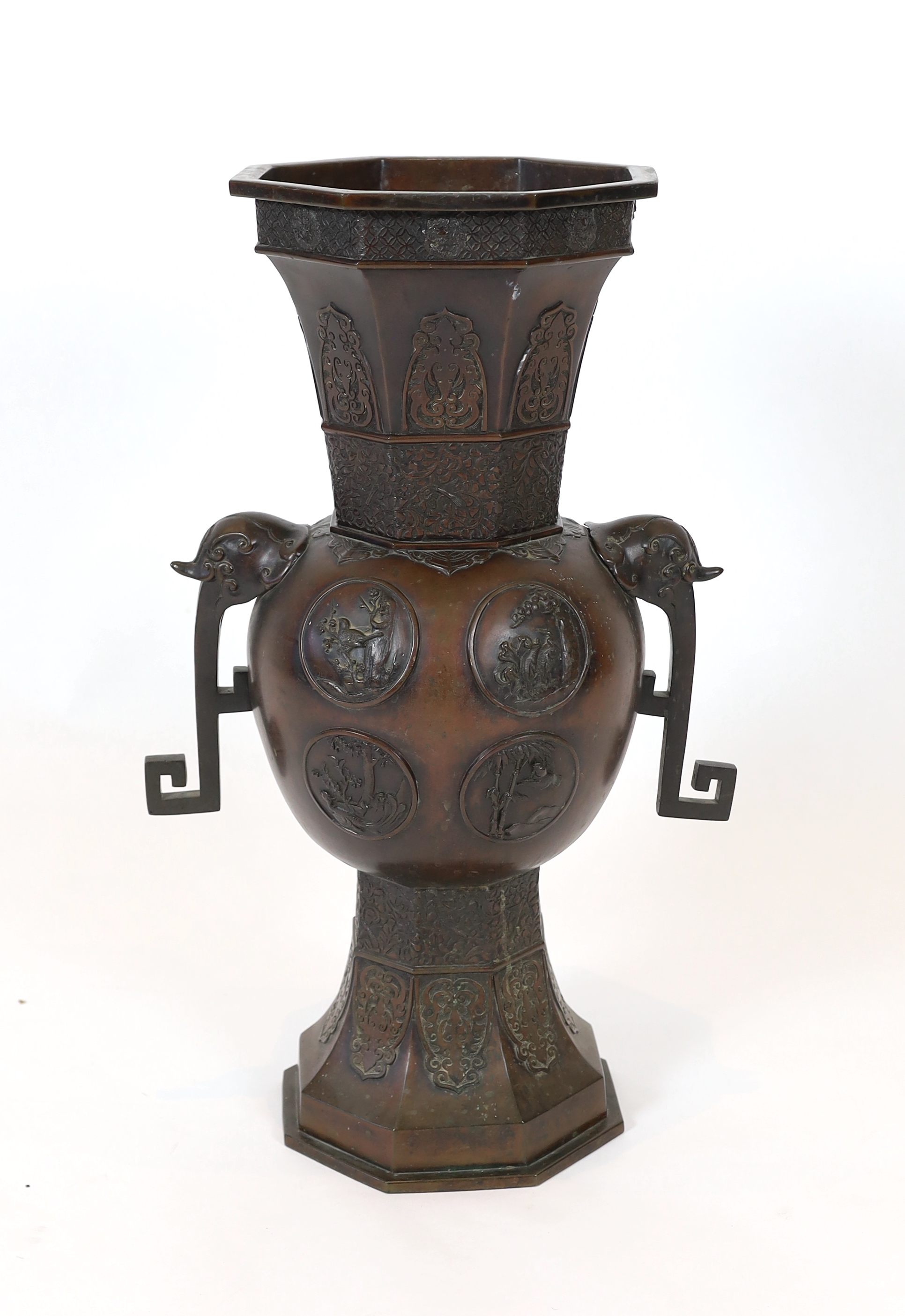 A tall Japanese archaistic bronze octagonal vase, Meiji period, base panel lacking